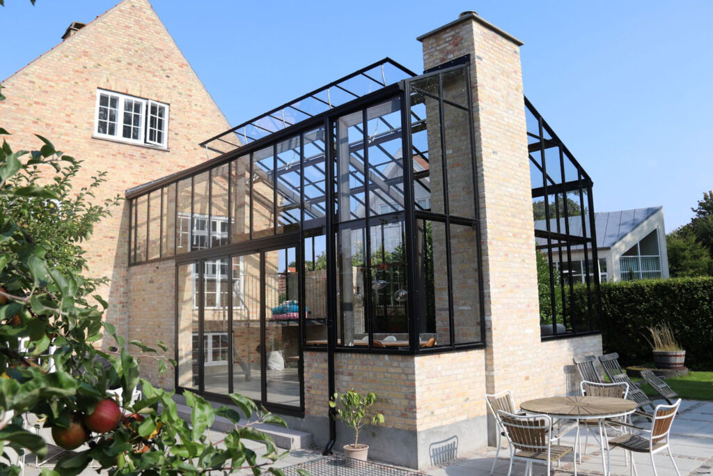 Atmospheric orangery an extension to residential house