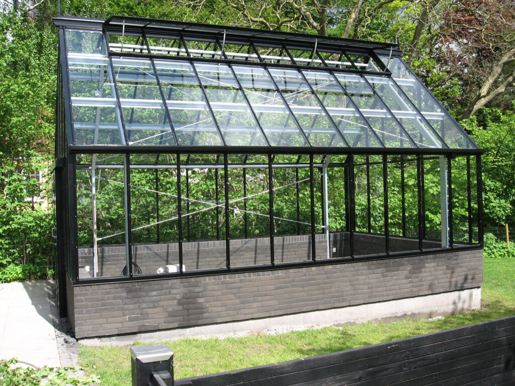 Free-standing greenhouse in domestic garden