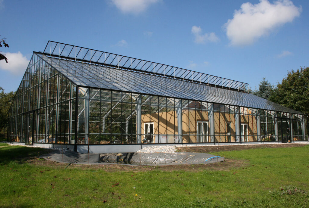 Glass building as climate shield on house