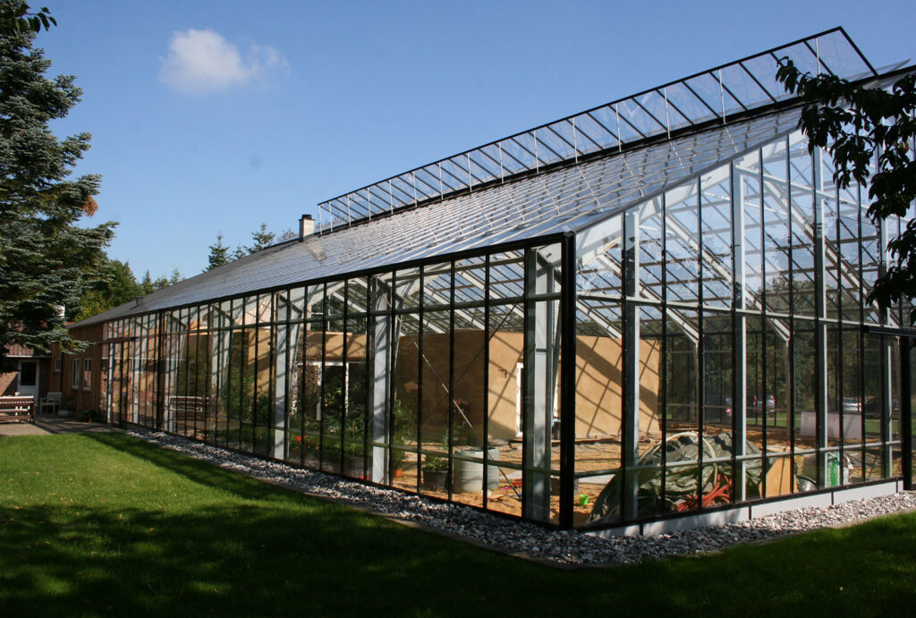 Glass building as climate shield on house